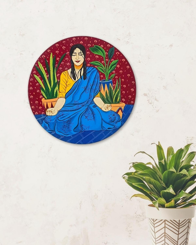 red wall plate with blue yogini